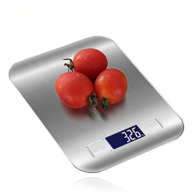 Digital stainless steel kitchen food scale with LCD display showing weight of tomatoes