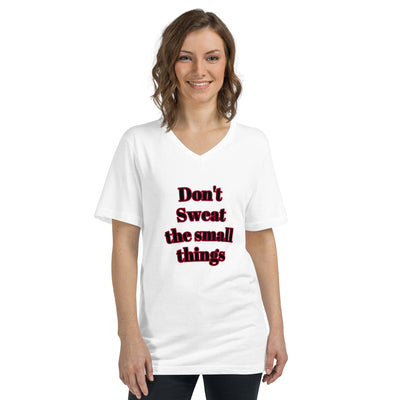 Woman wearing a white unisex short sleeve v-neck t-shirt with "Don't Sweat the small things" text print