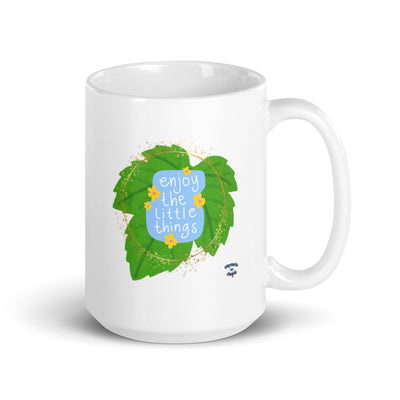 White glossy ceramic mug with "Enjoy the little things" design, microwave and dishwasher safe
