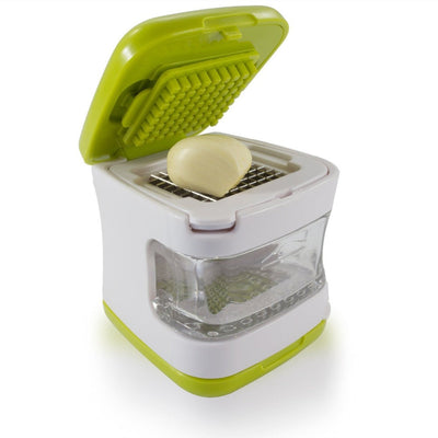 Compact small garlic press with stainless steel blades and a green lid for crushing garlic cloves efficiently