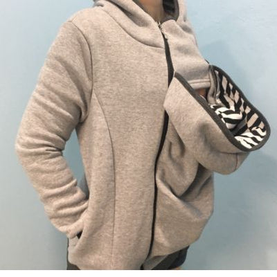 Maternity Babywearing Hoodie in light gray with baby carrier insert, designed for comfort and warmth during pregnancy and babywearing.